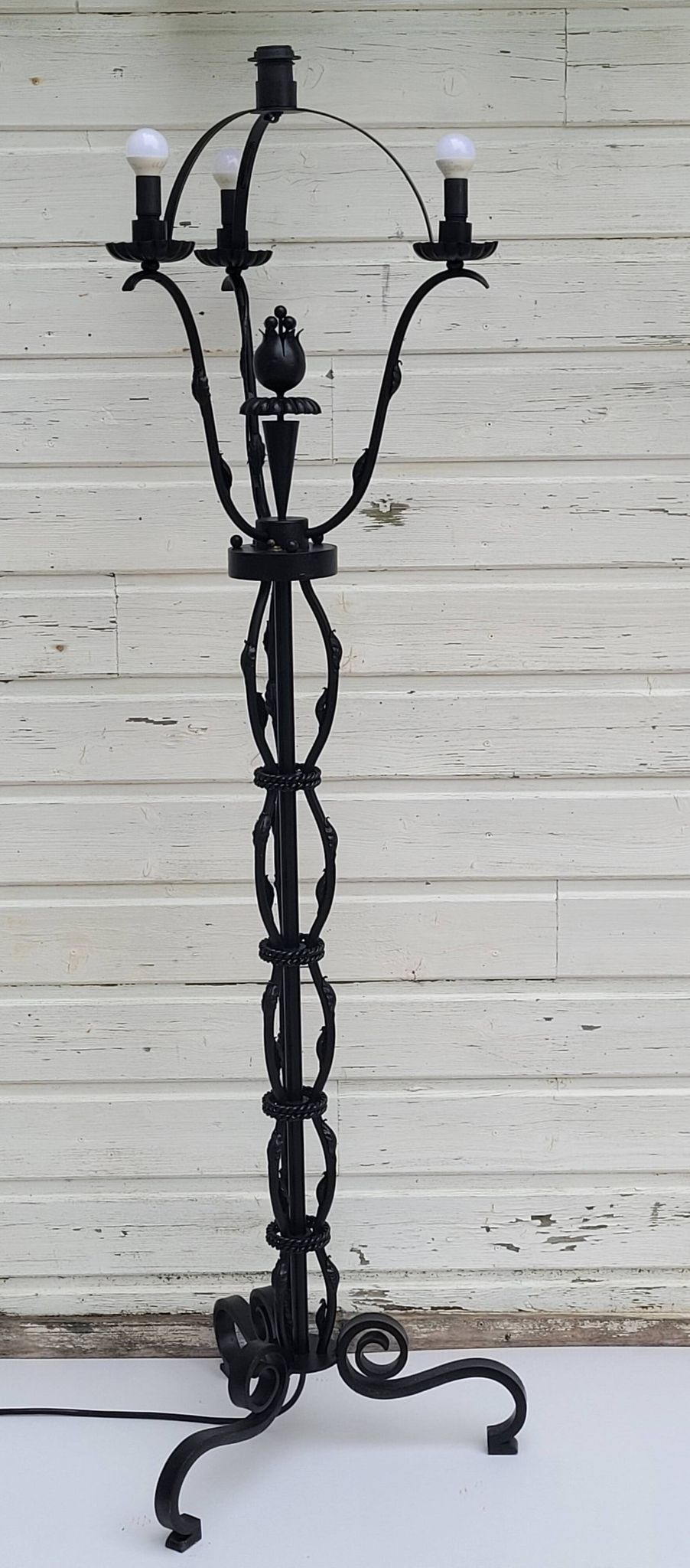 Black wrought iron floor lamp attributed to Gilbert Poillerat