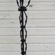 Black wrought iron floor lamp attributed to Gilbert Poillerat