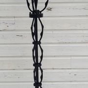 Black wrought iron floor lamp attributed to Gilbert Poillerat
