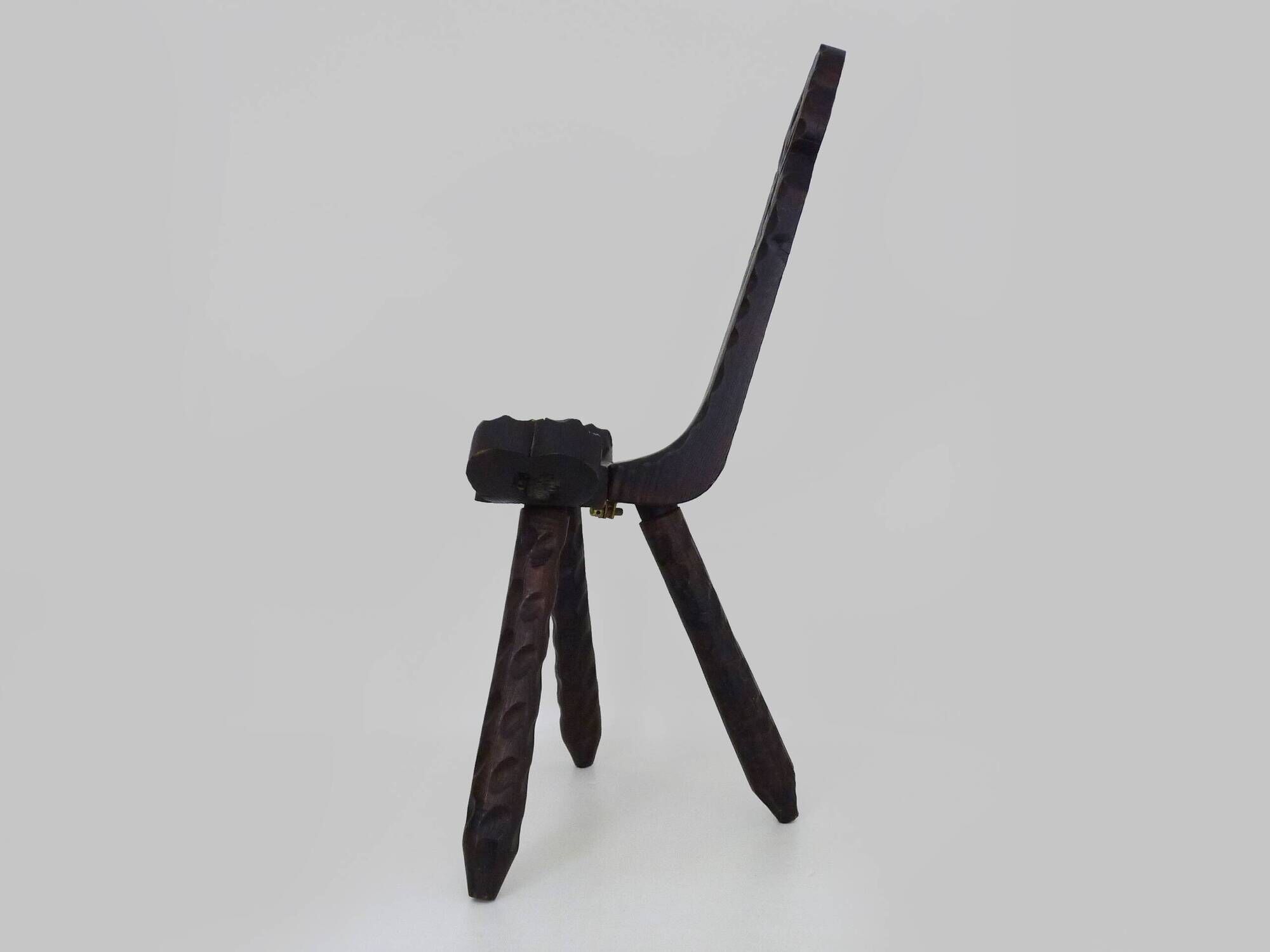 Brutalist tripod chair in raw wood. solid wood chair