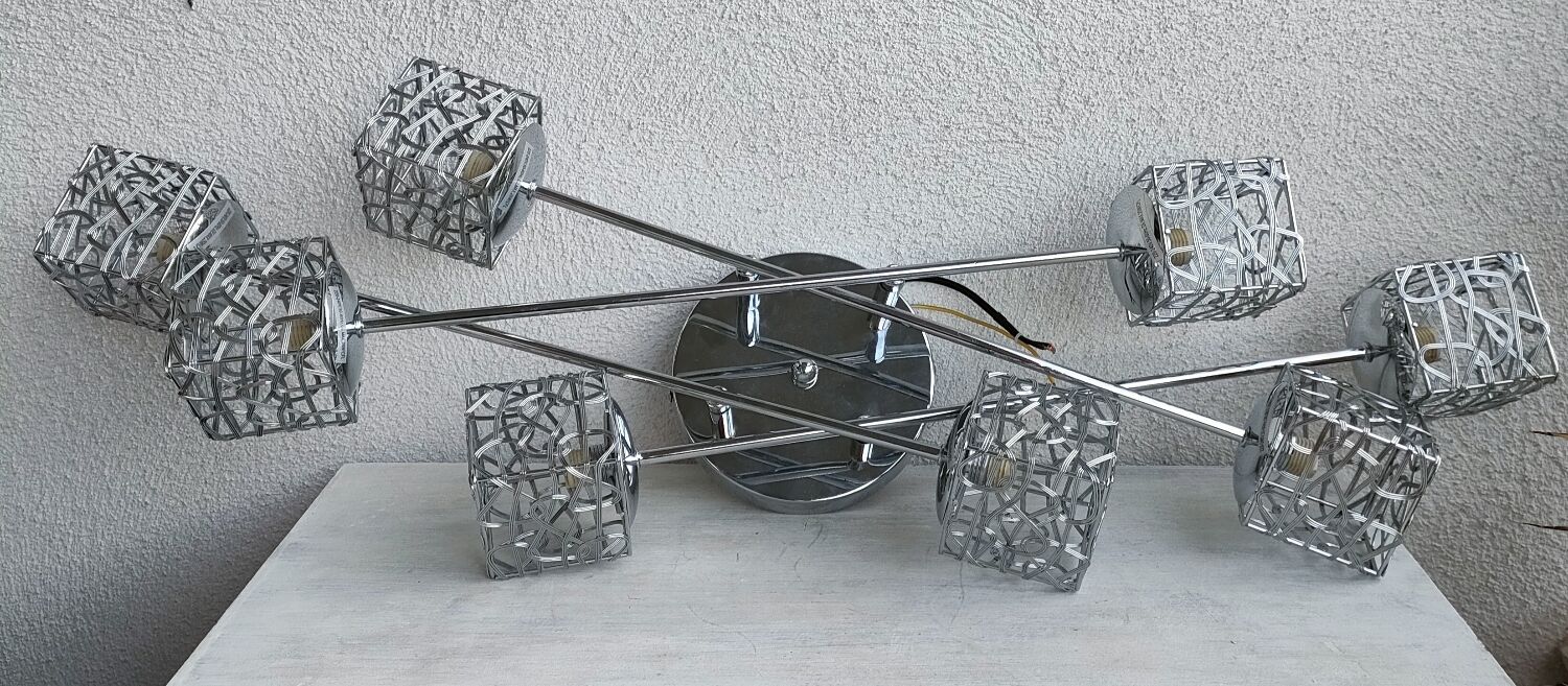 Articulated chromed metal luminaire