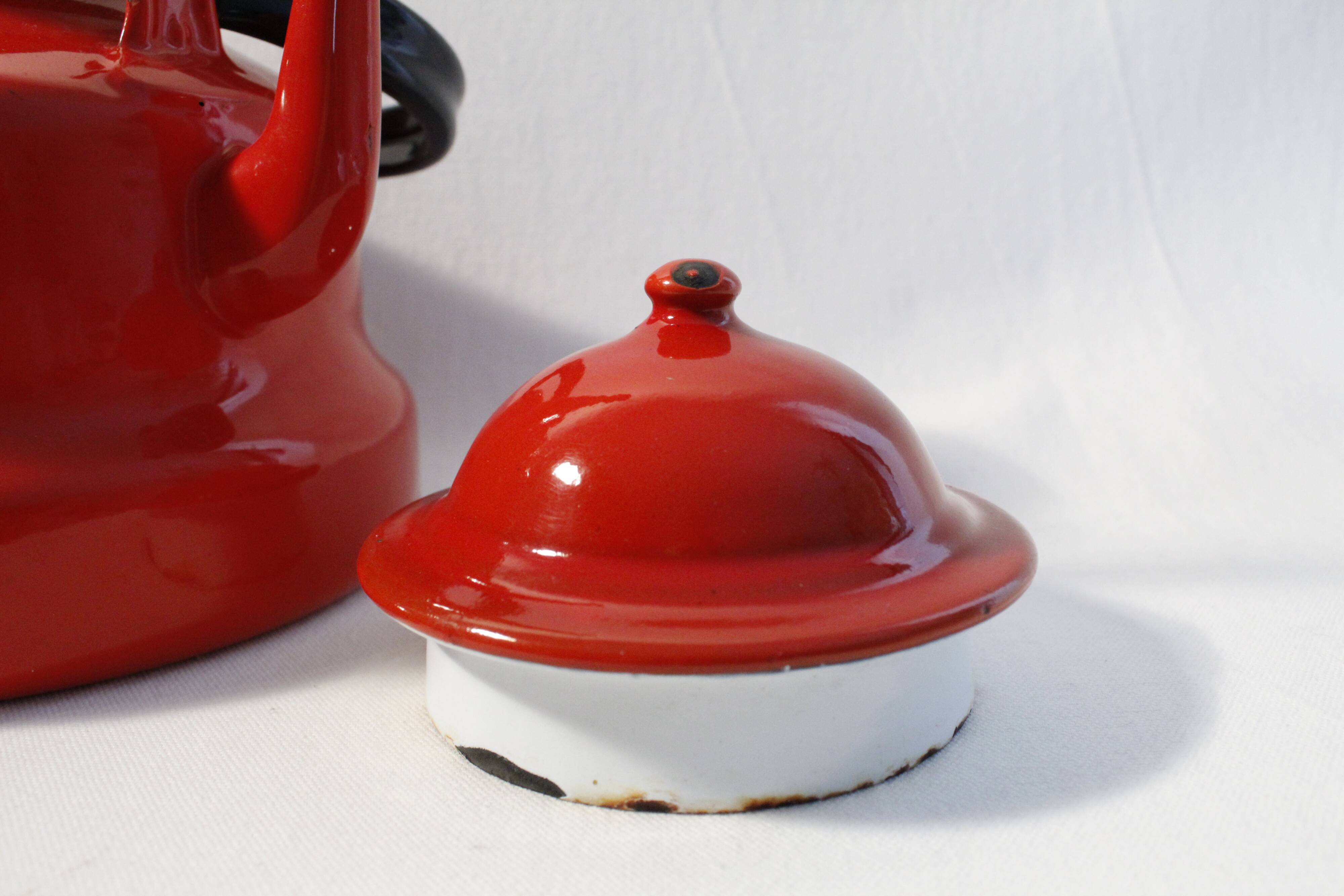 Vintage red enamelled metal kettle