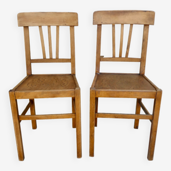 Pair of bistro chairs with perforated seat