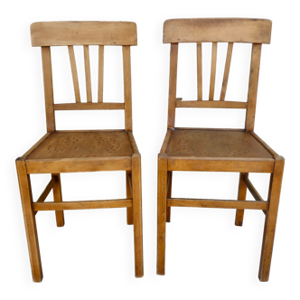 Pair of bistro chairs with perforated seat