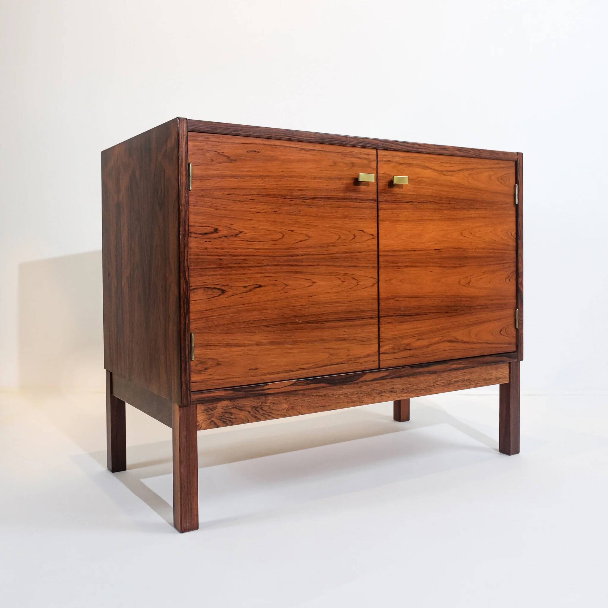 Vintage Swedish commode in rosewood with brass handles.