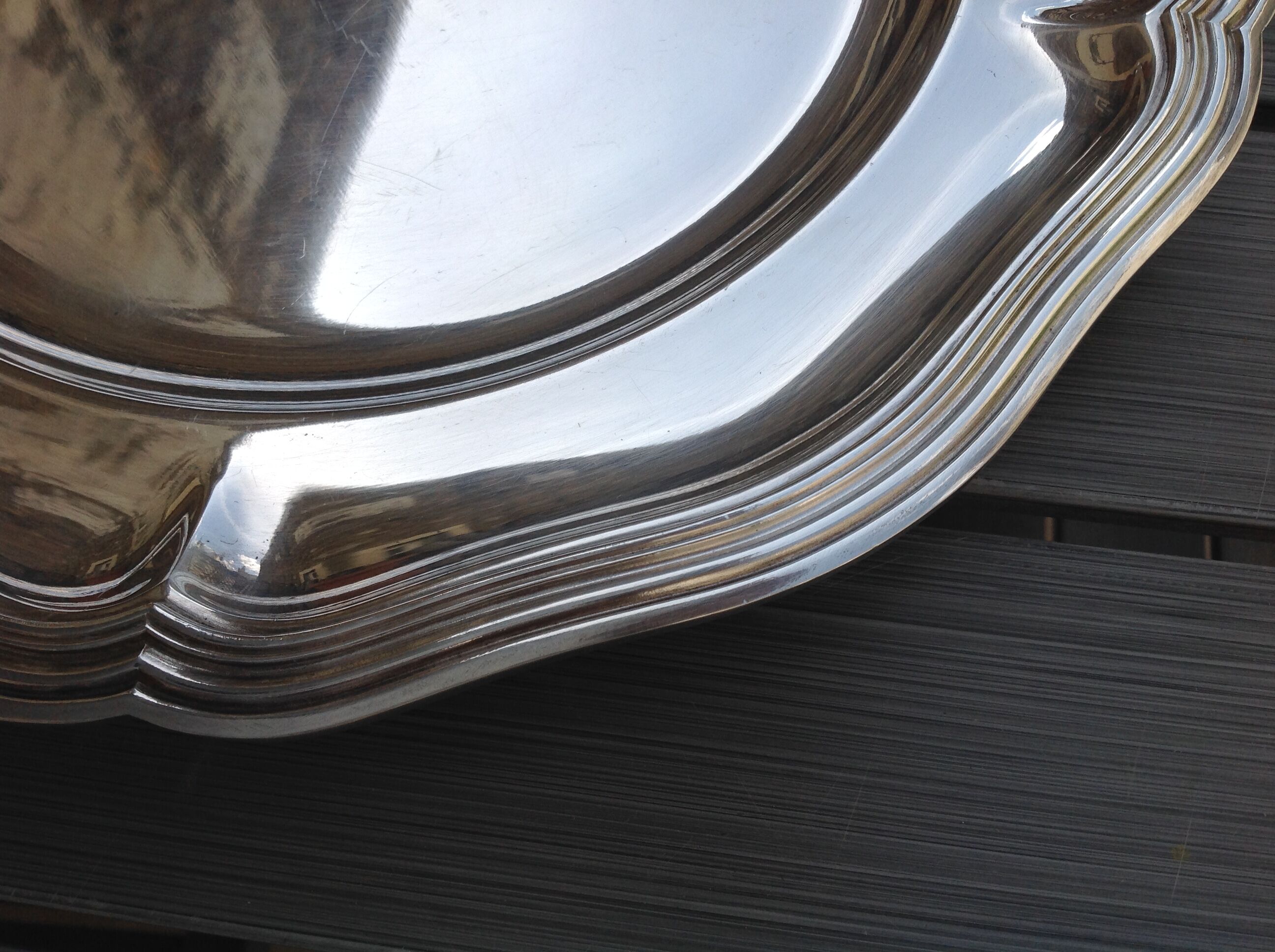 Silver metal dish with twisted edges