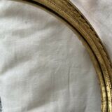 Oval wall mirror in baroque gilded plaster frame 29x20cm