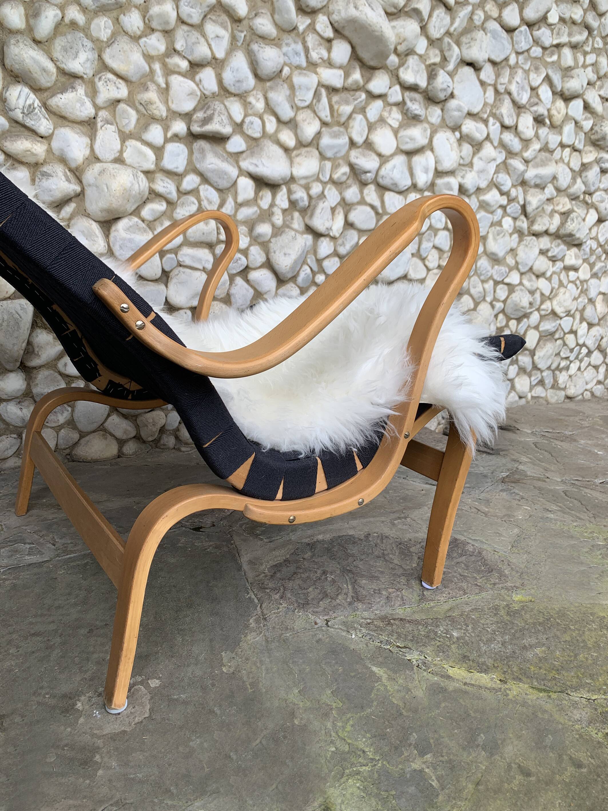 Pernilla armchair in black canvas by Bruno Mathsson, Dux, Sweden 1970