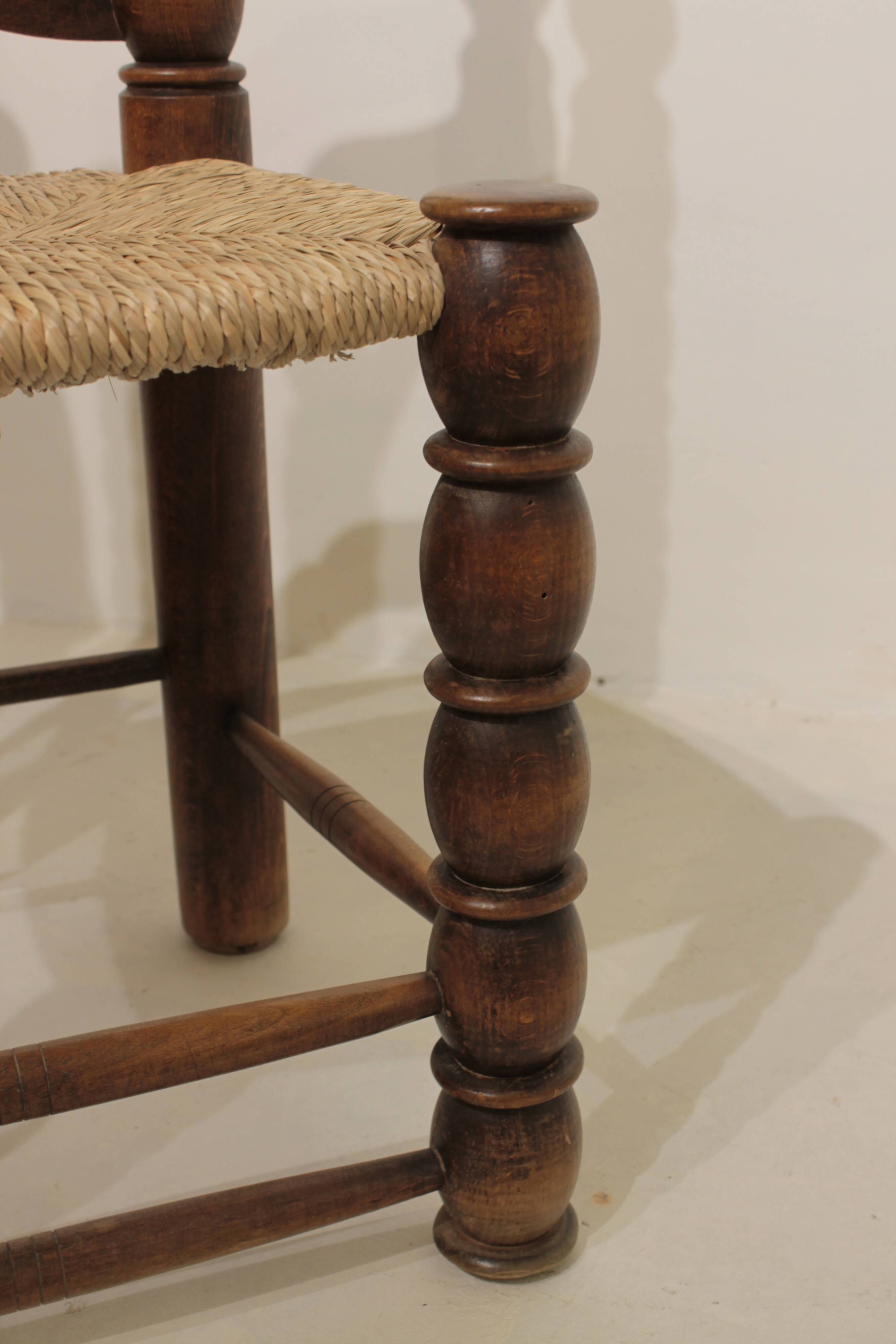 Pair of rustic chairs in turned wood with straw seats