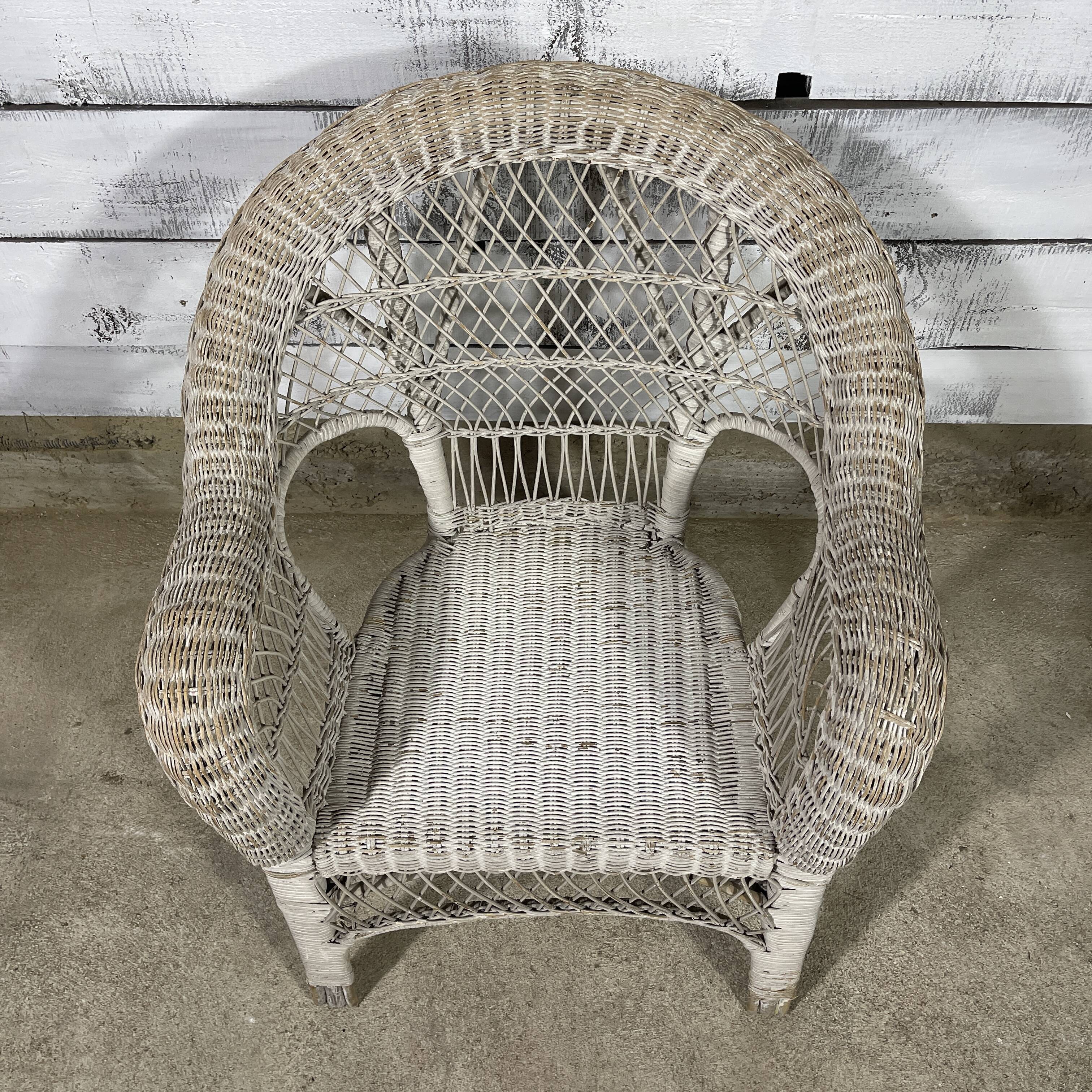 Vintage white rattan armchair