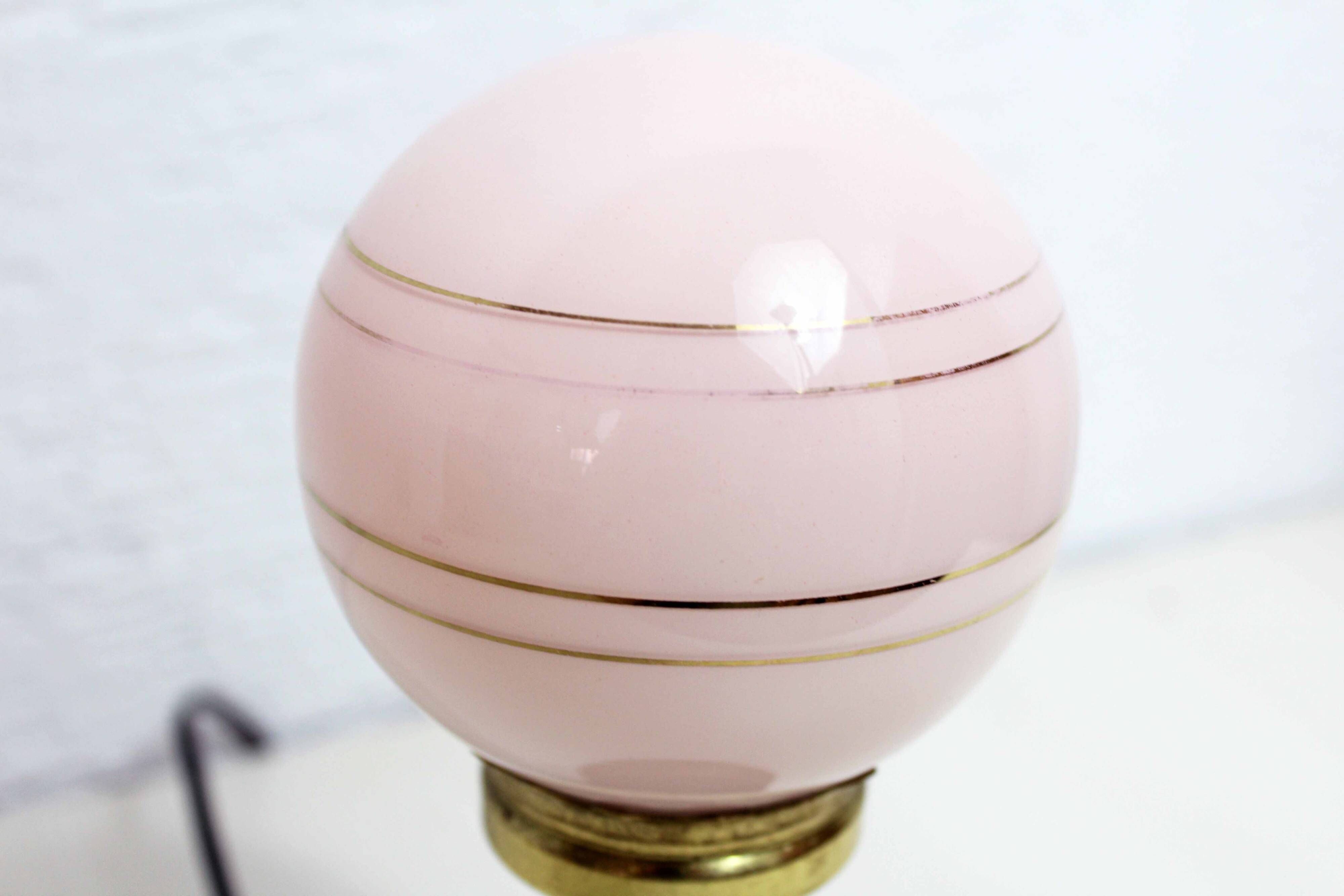 Turned wood and pink glass lamp