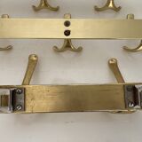 Three vintage 1960s gold coat racks 4, 3 and 2 hooks
