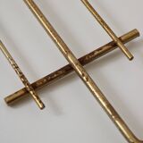 String shelf in teak and gold metal