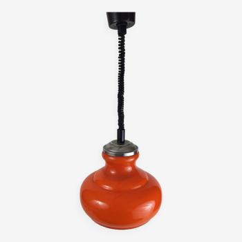 Suspension rises and falls in vintage orange glass