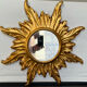 Miroir soleil en bois doré