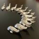 11 whale-shaped metal knife holders