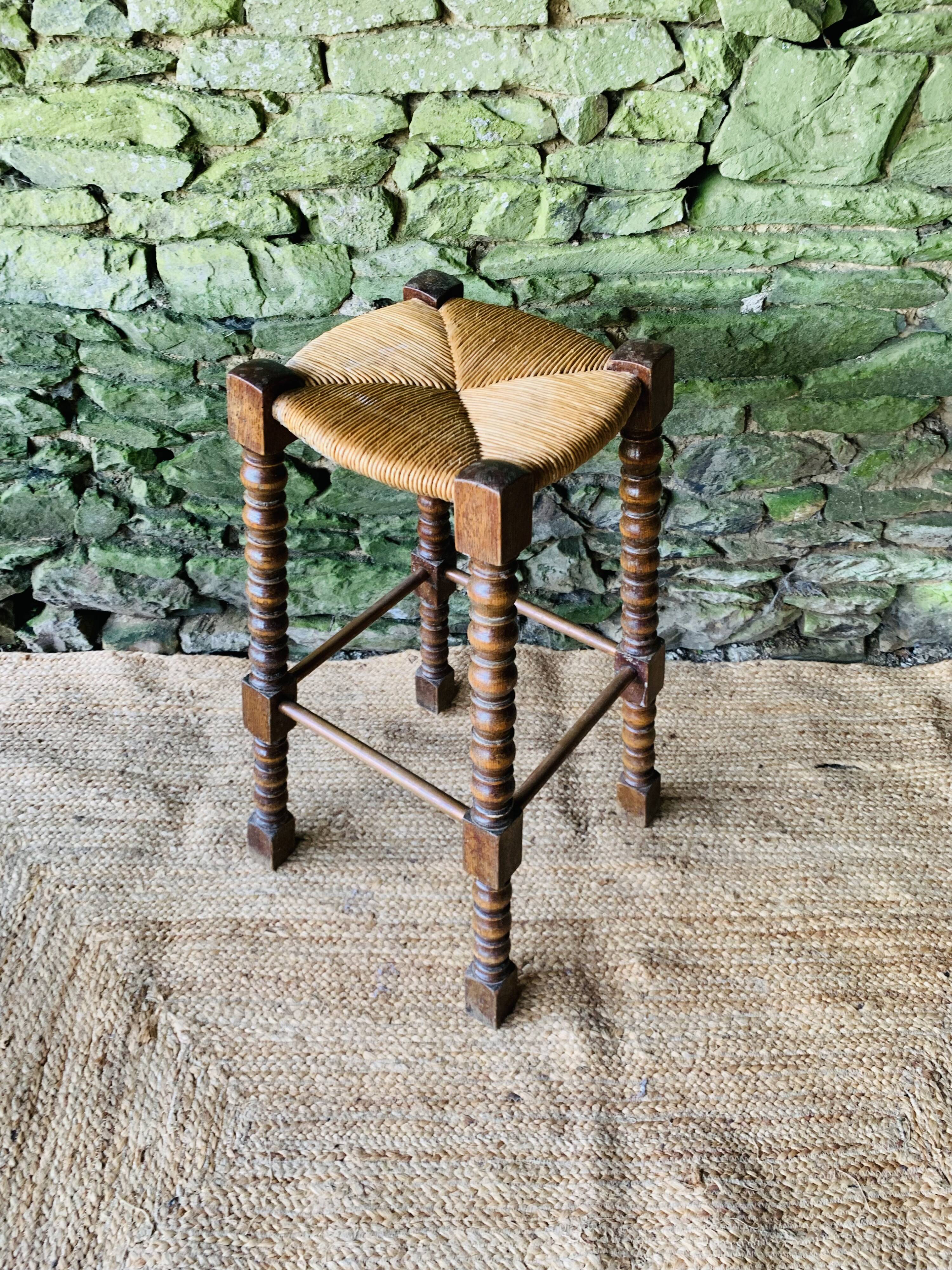 High stool in turned wood