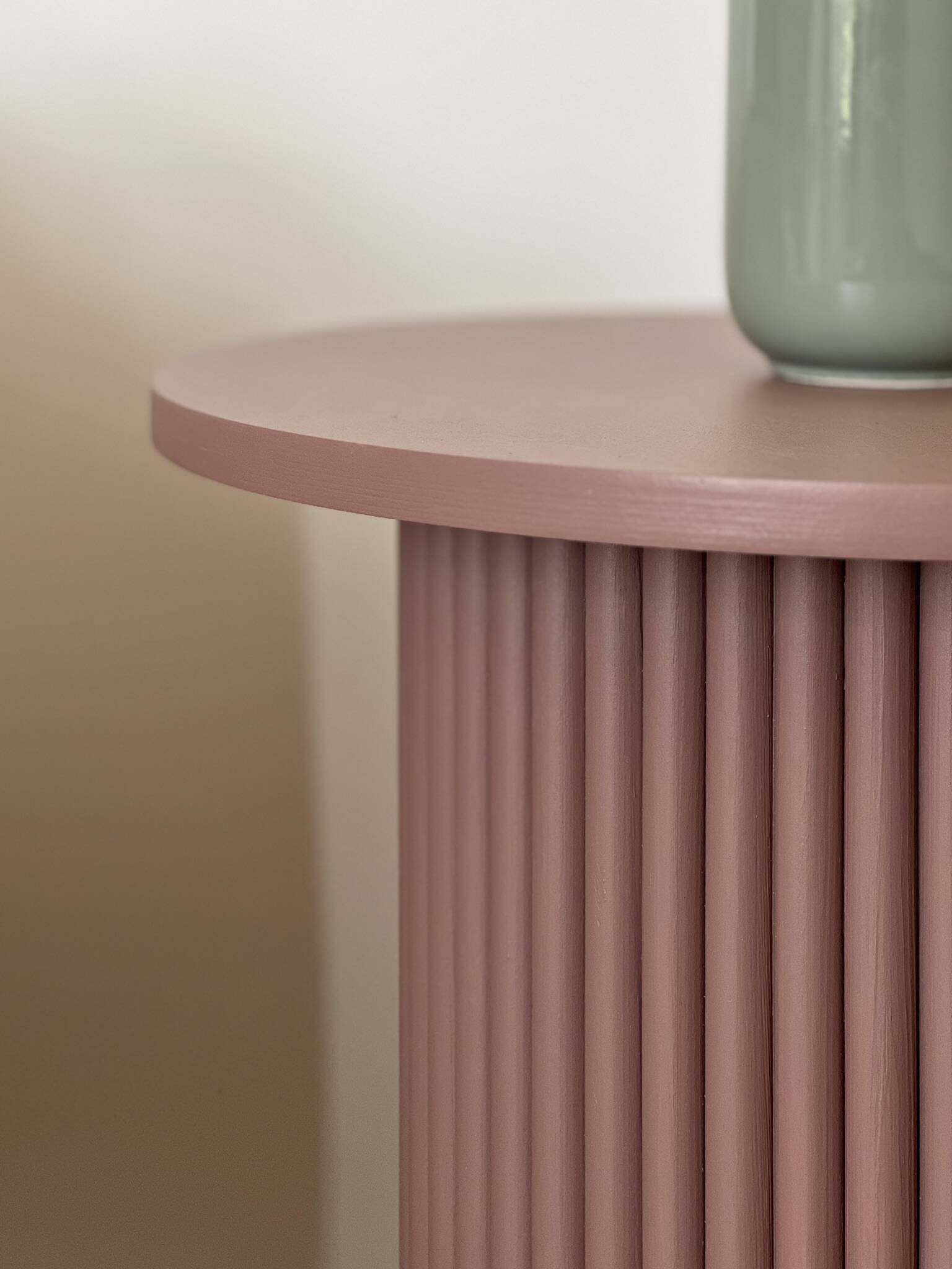 round and fluted side table in mauve, dimmed pink purple