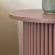 round and fluted side table in mauve, dimmed pink purple