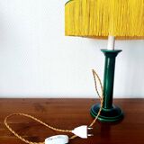 Green ceramic lamp with a vintage pleated fringe shade.