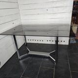 Chromed metal table with smoked glass top