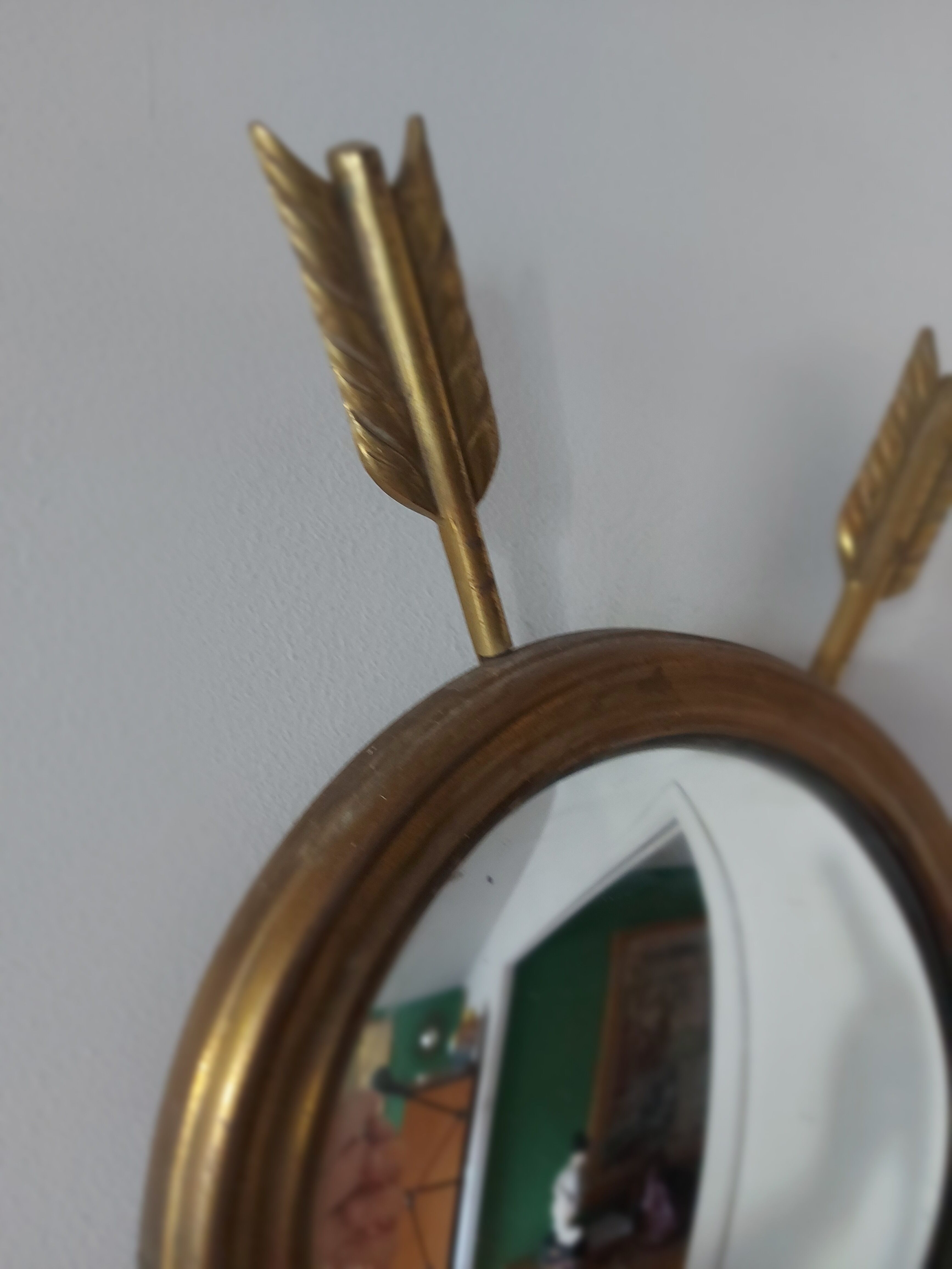 Curved brass witch's mirror