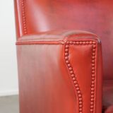 Set of 2 red-colored design armchairs made of sheepskin leather