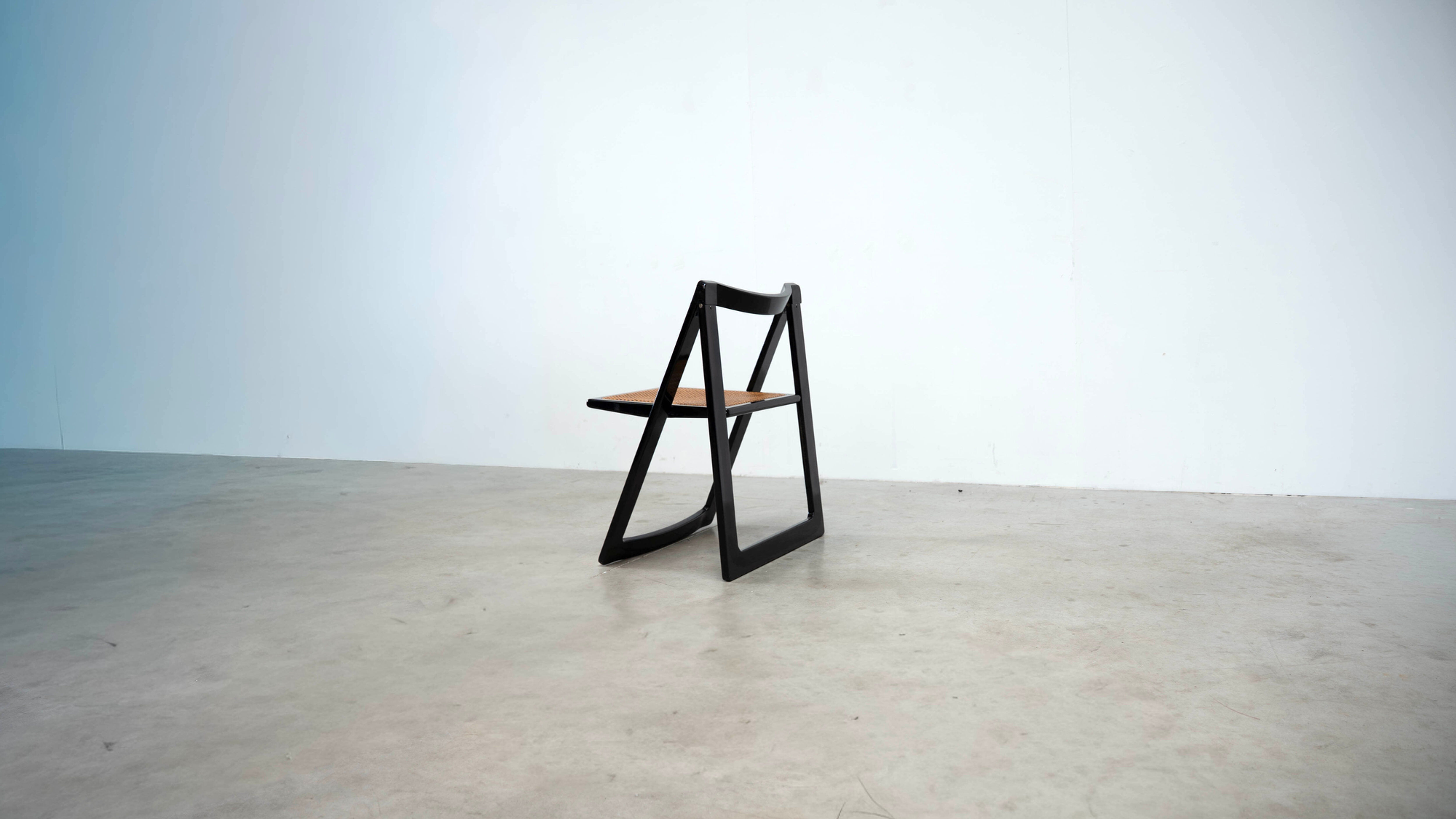 Set of eight folding dining chairs designed by Aldo Jacober for Alberto Bazzani