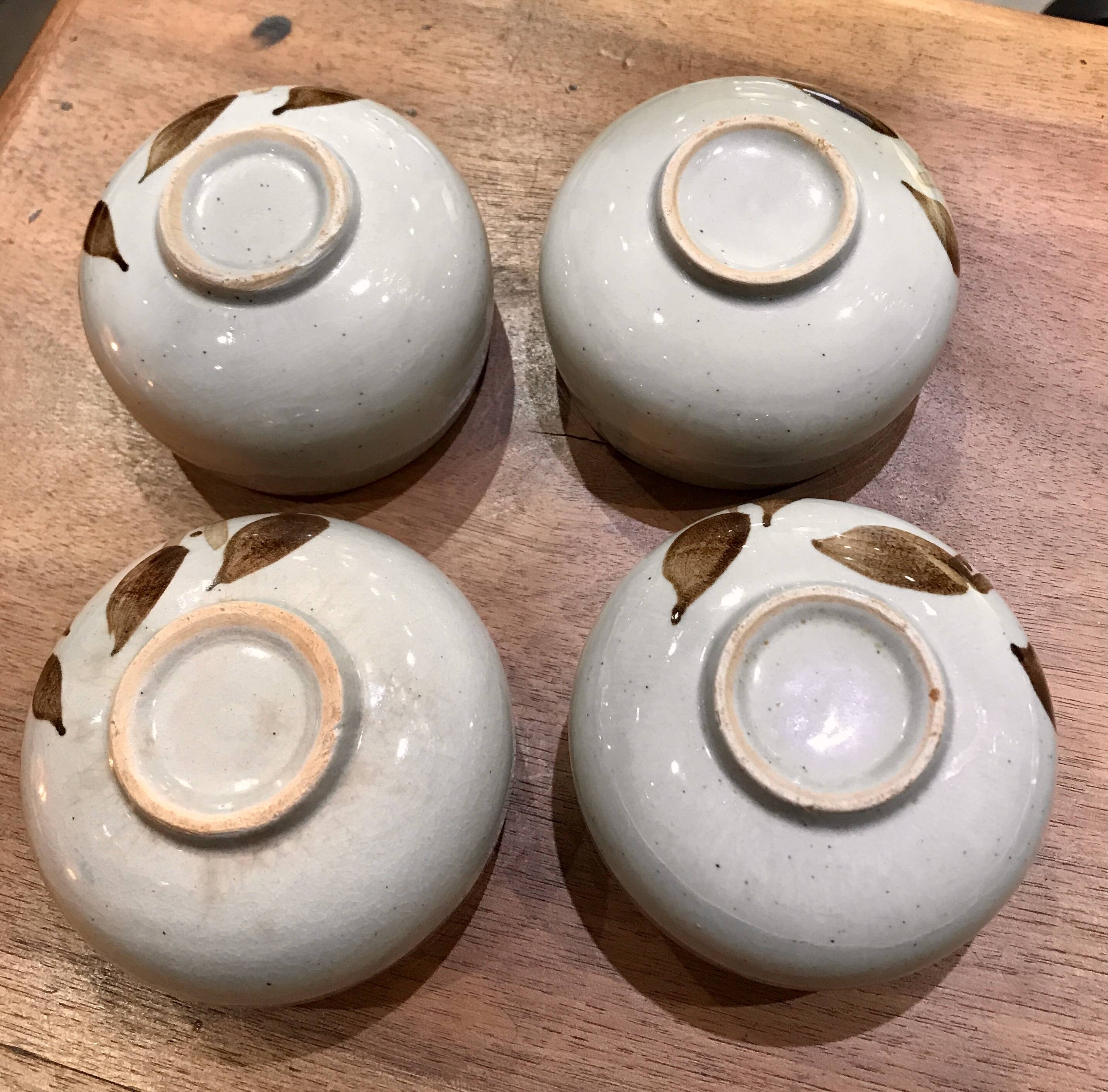 Enamelled stoneware tea bowls with plant decor