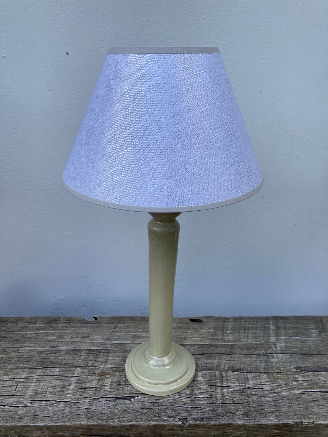 Beige ceramic lamp and iridescent white lampshade