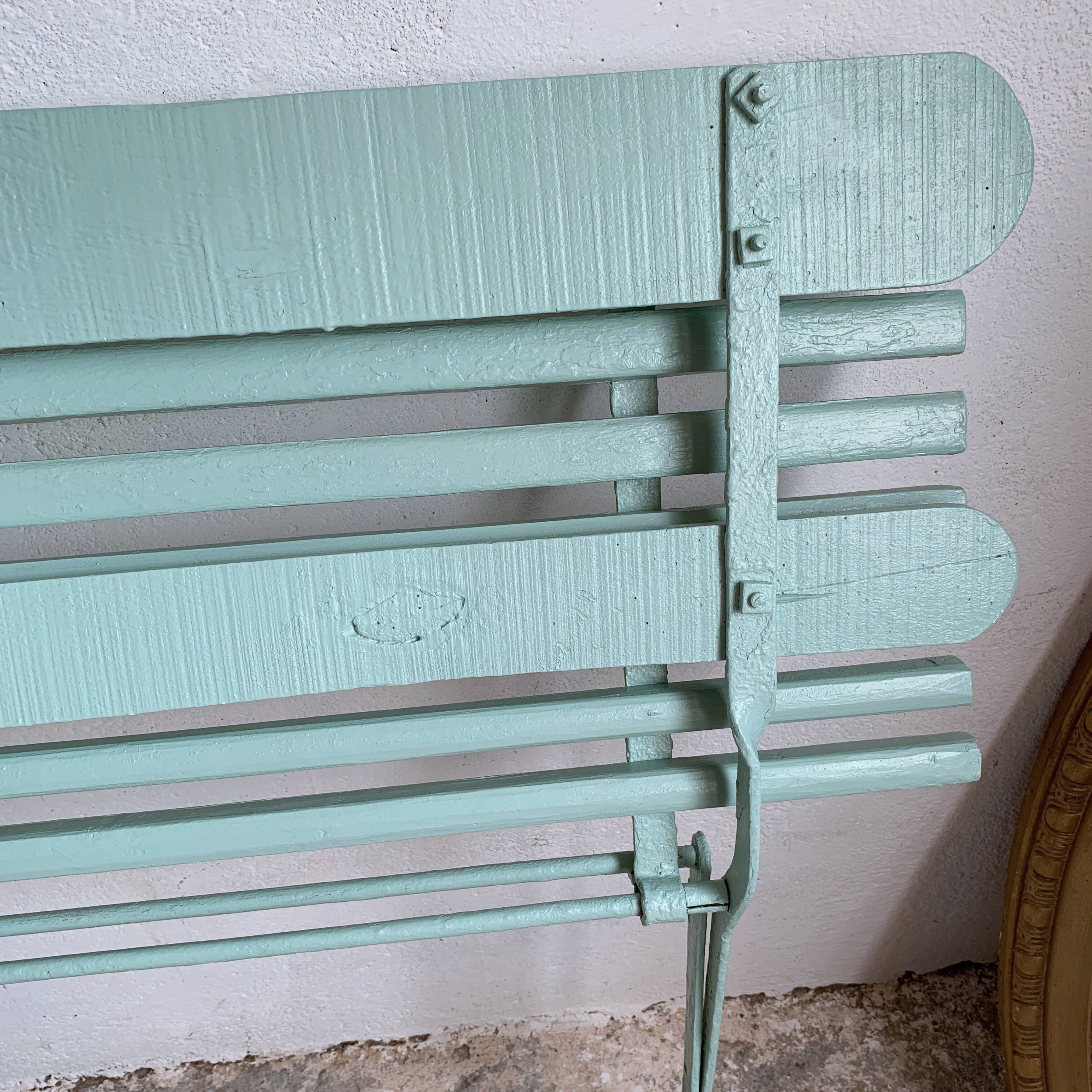 Former folding garden bench with wooden and metal slats