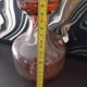 Vintage glass carafe in pink-orange, retro-chic style.