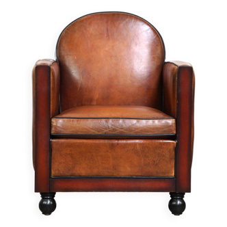 Fauteuil design Art Déco en peau de mouton avec bois et beau cuir couleur cognac