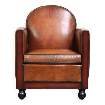 Sheepskin Art Deco design armchair with wood and beautiful cognac-colored leather