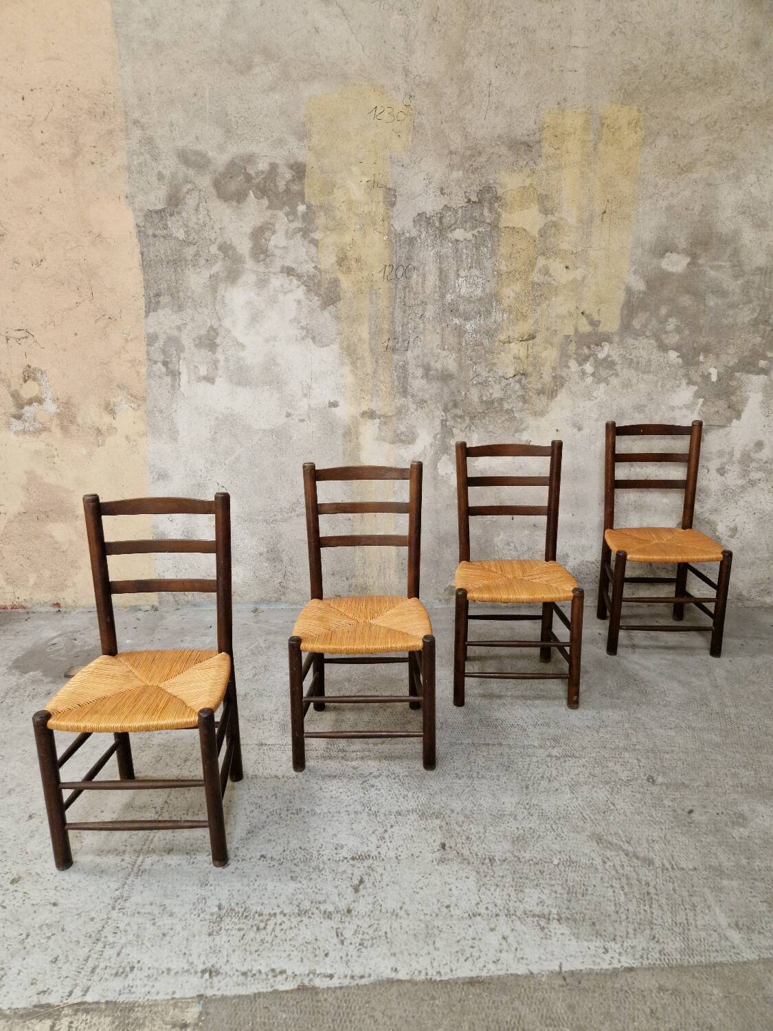 4 wooden and straw chairs