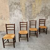 4 wooden and straw chairs