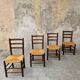 4 wooden and straw chairs
