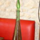 Vintage green faceted glass bottle with its cap 1970