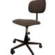 Brown vintage office chair from the 70s on wheels.
