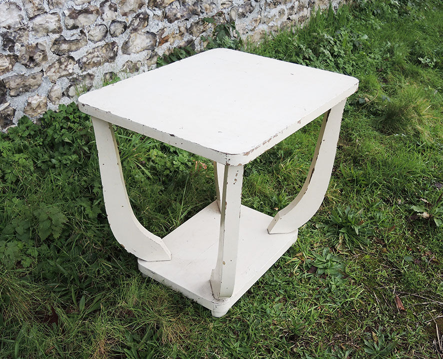 Old white wooden peestal table in art deco style