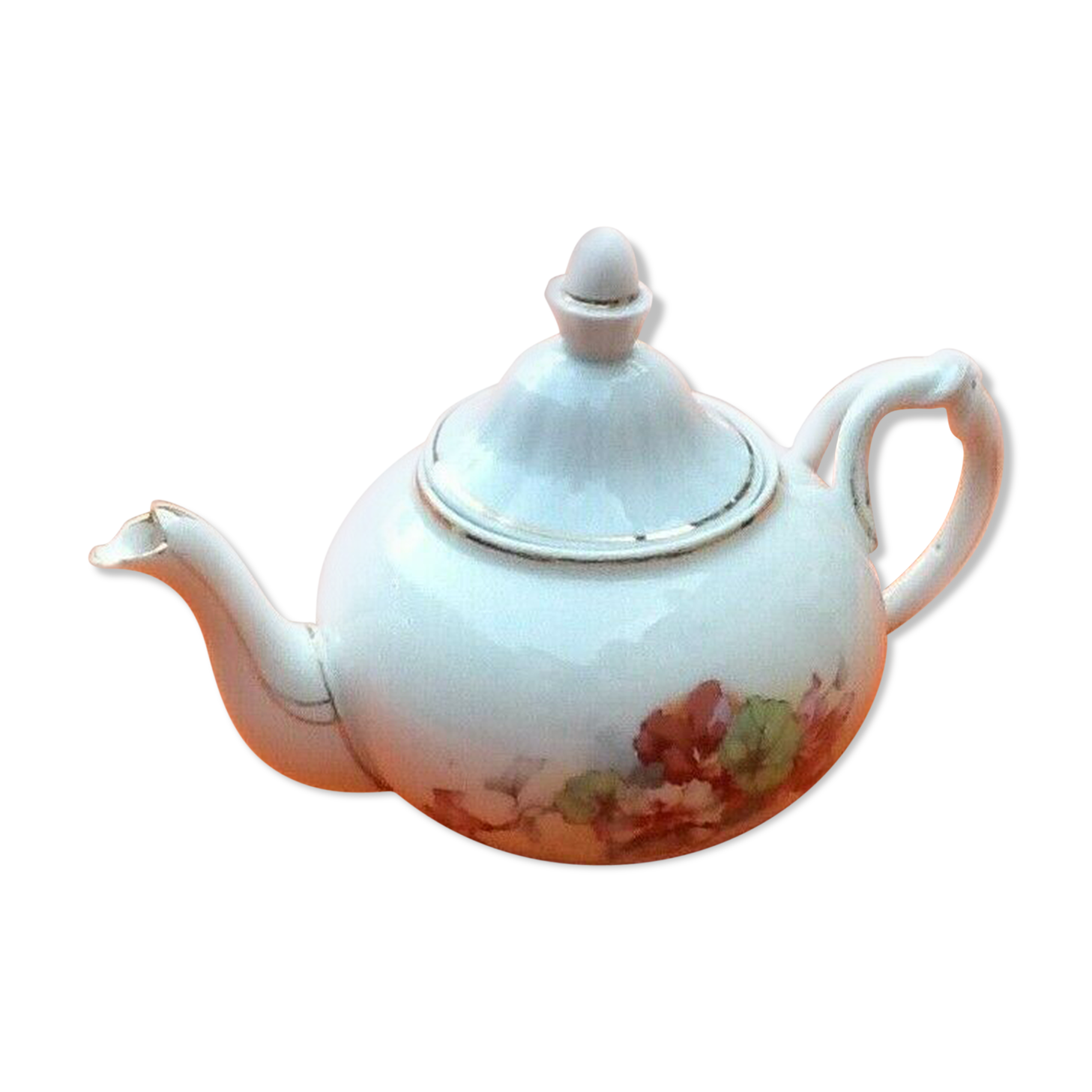 Old porcelain teapot with floral decoration
