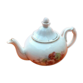 Old porcelain teapot with floral decoration