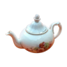 Old porcelain teapot with floral decoration