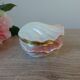Vintage shell-shaped catchall in iridescent cream and pink ceramic.