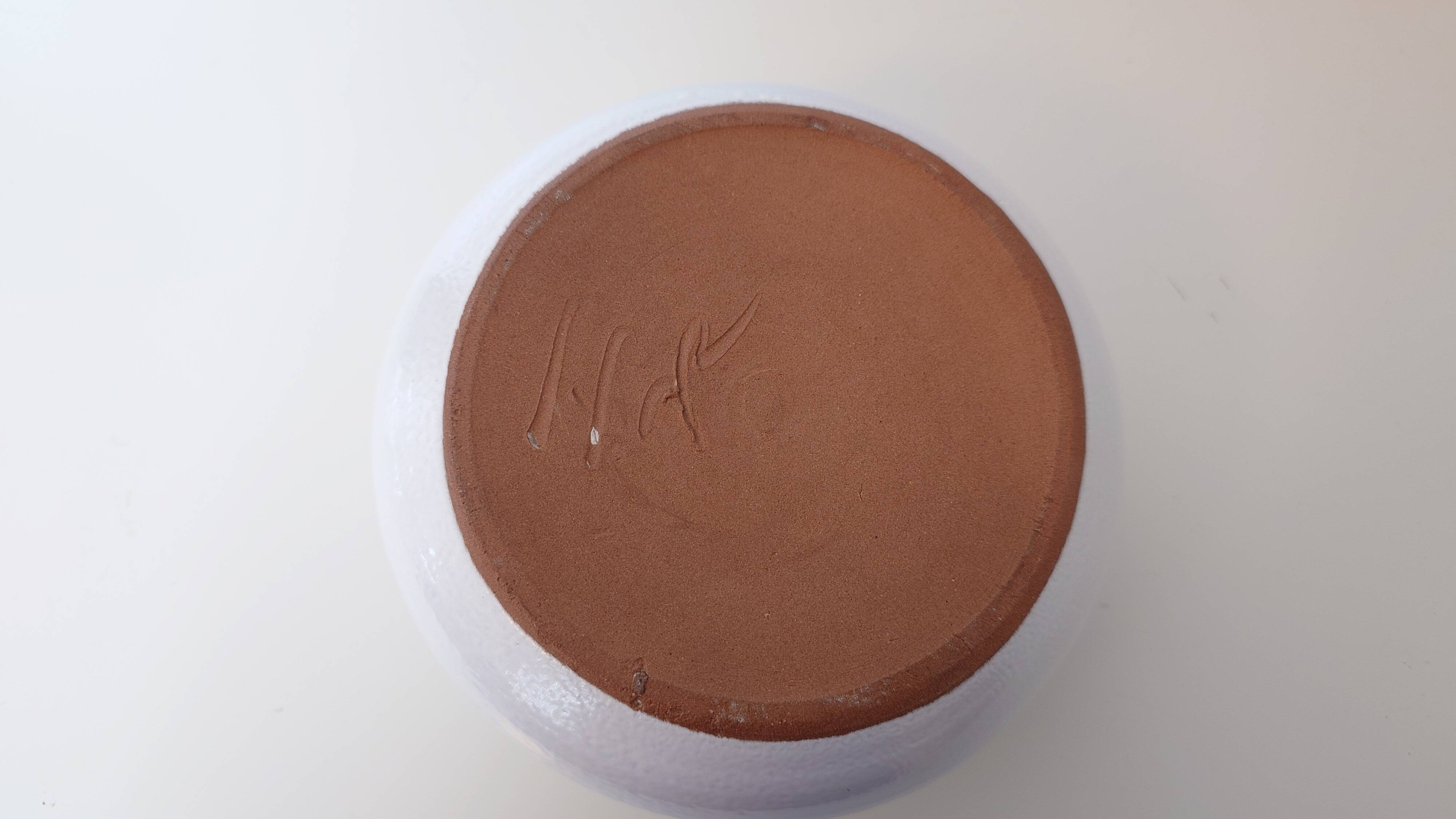 Centrepiece, white ceramic flower holder signed.