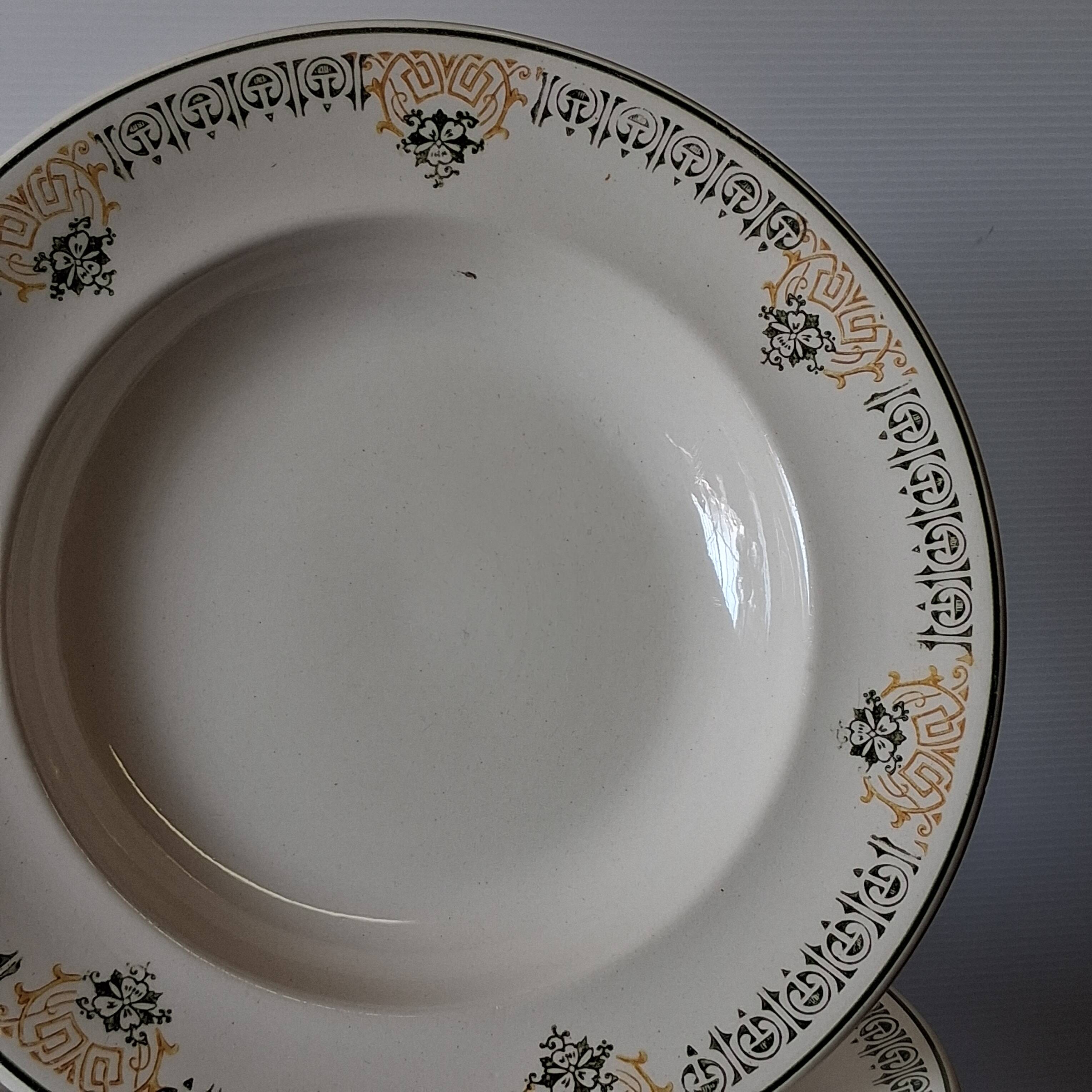Set of 7 antique deep plates from Longwy, "Savigny" model, in good condition.
