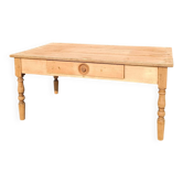 Coffee table in raw wood with turned legs.