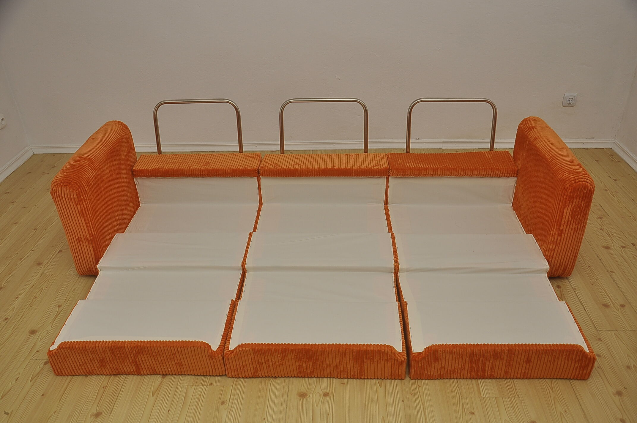 Orange corduroy modular sofa, 1970s.