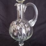 Wine carafe on foot, in cut and enameled glass