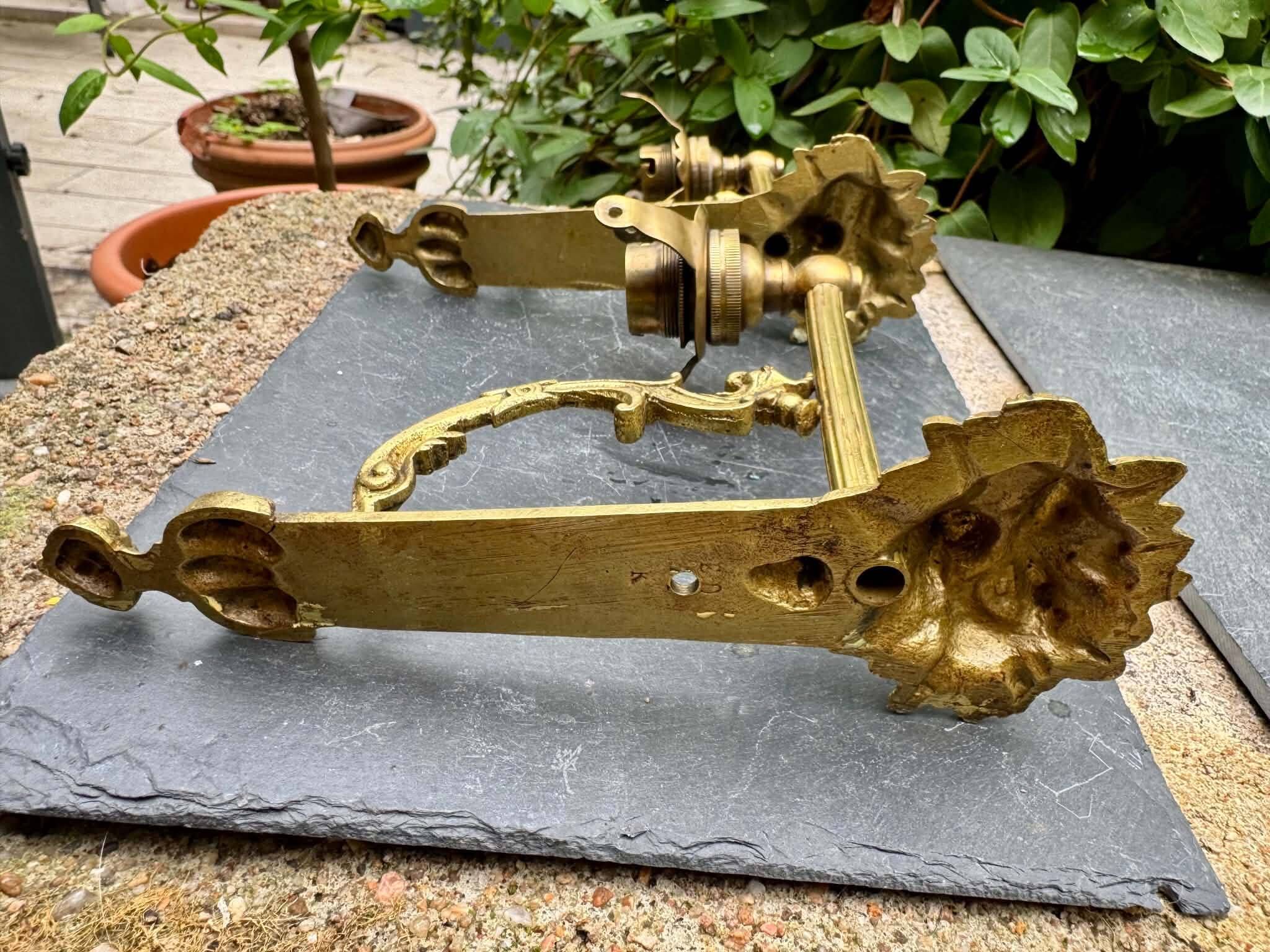 2 brass lion Empire wall sconces